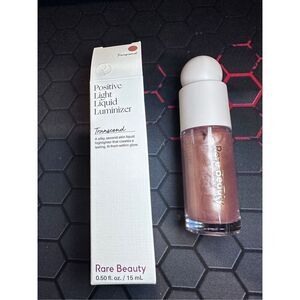 Rare Beauty by Selena Gomez Positive Light Liquid Luminizer Highlight Color: Tra